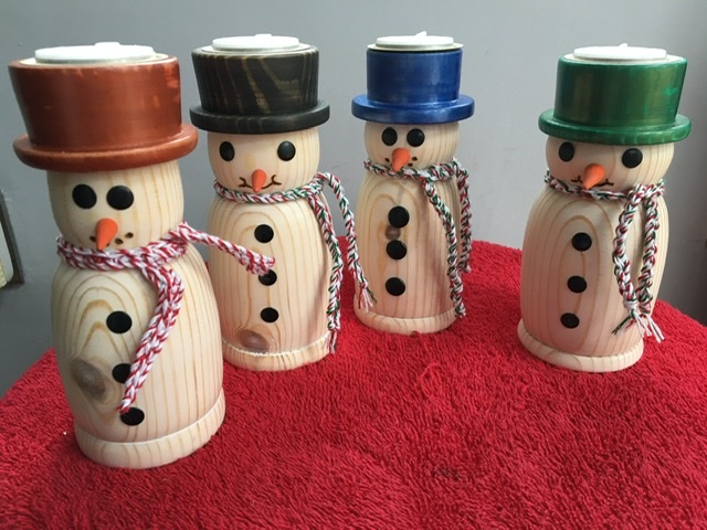 Medium size snowmen with T-light candles.